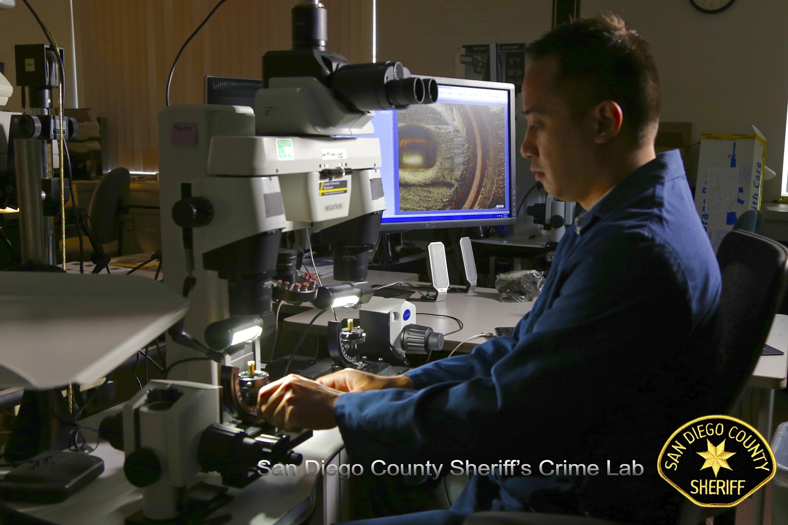 Stephen working at a comparison microscope